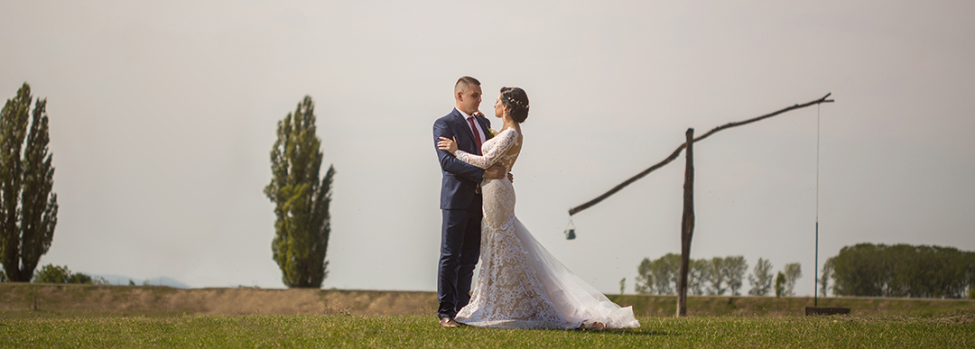 Wedding couple hugs in nature